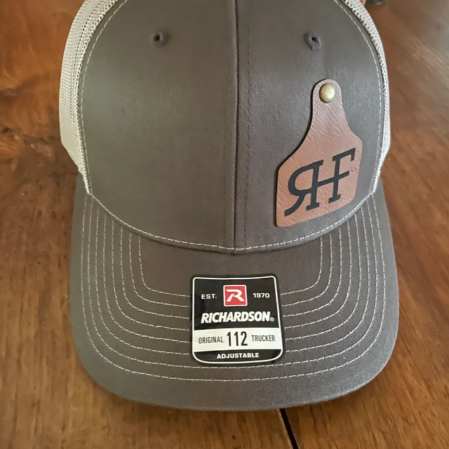 brown hat with custom cattle tag patch