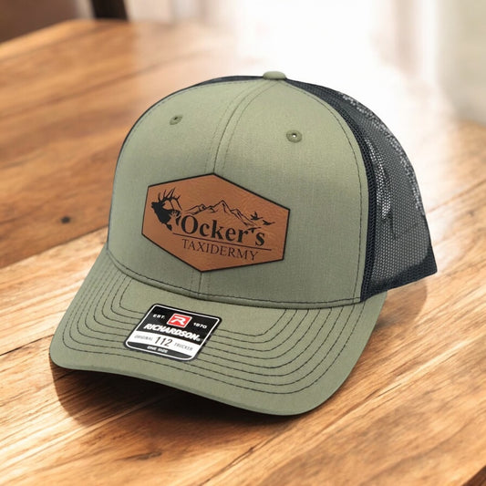 Green hat with a logo on a patch