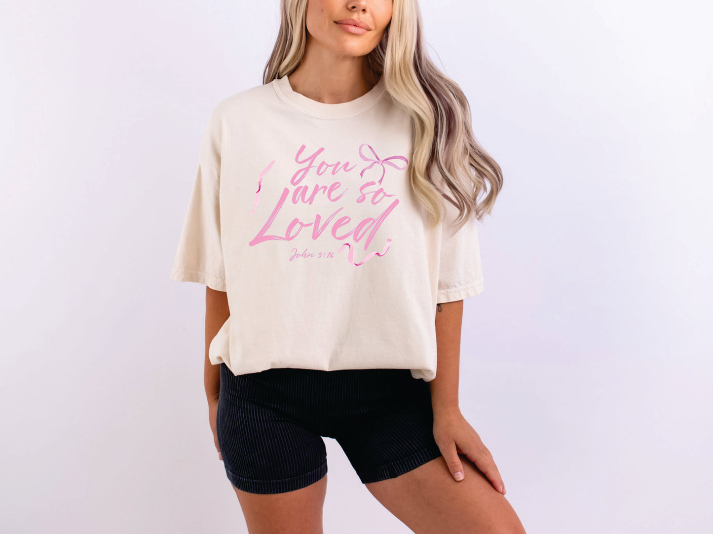 Cream shirt with a bible verse "you are so loved" printed on it