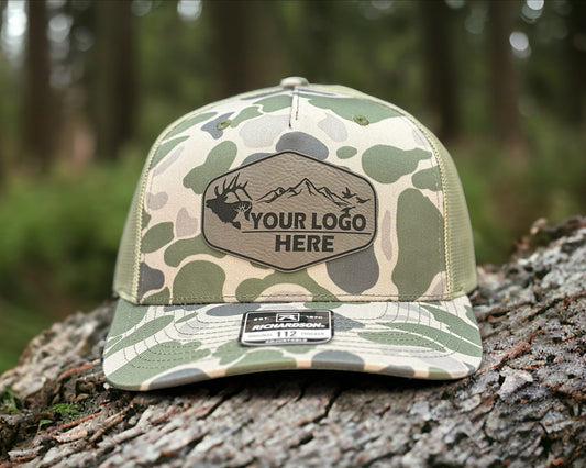 Camo hat with a custom patch outdoors