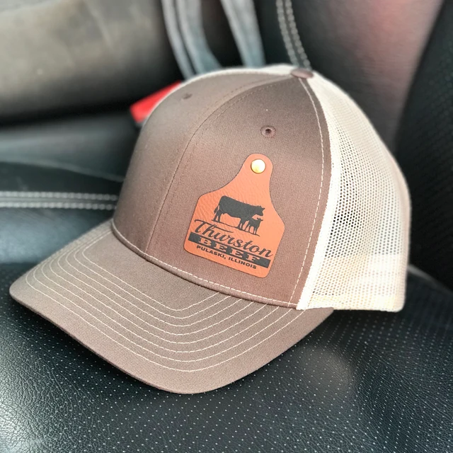 brown hat with custom cattle tag patch