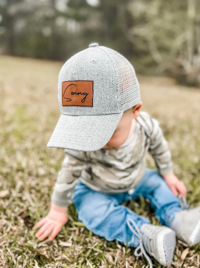 Kid model wearing a custom name patch hat